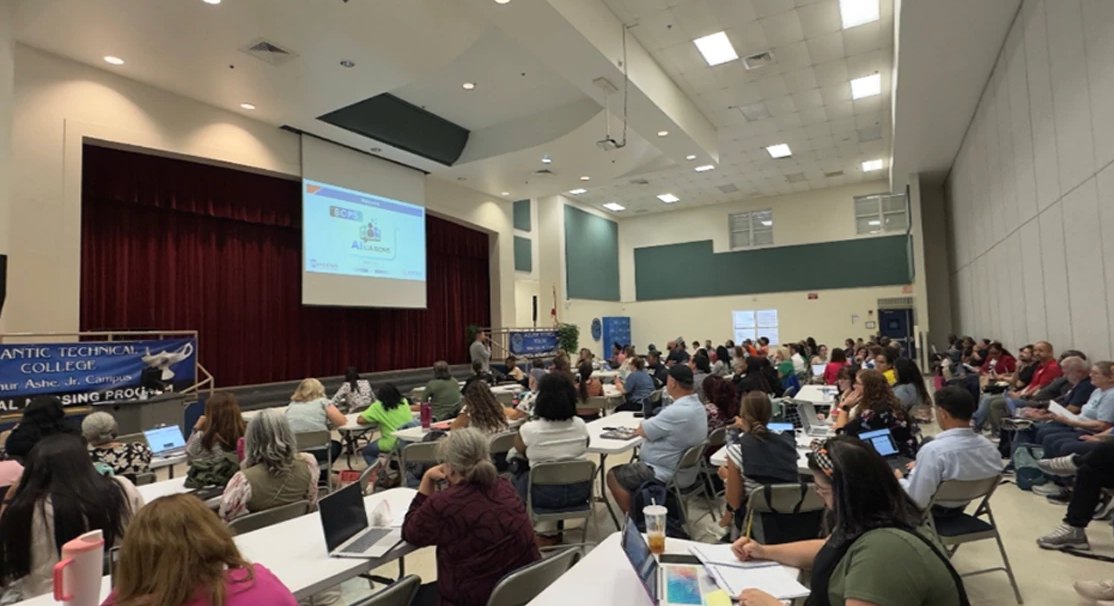 AI Liaisons filling the Arthur Ashe Campus multipurpose room at the 2026-2027 kickoff